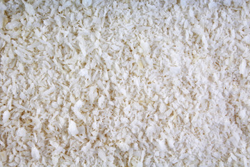 Desiccated coconut texture pattern background. Design wallpaper.