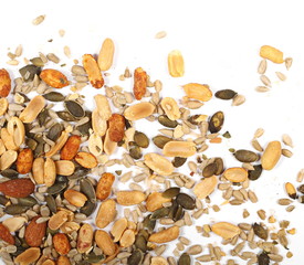 Healthy mix of salty and spicy peanuts, almonds, sunflowers, and pumpkin seeds, isolated on white background