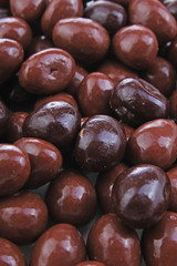 Chocolate balls drops closeup texture studio photo.