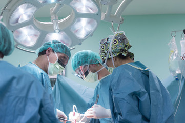 Team of Surgeons Operating in the Hospital.