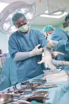 Surgeon Checking Wearing Gloves Before Operation