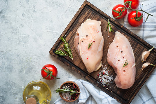 Raw Chicken Fillet On Cutting Board