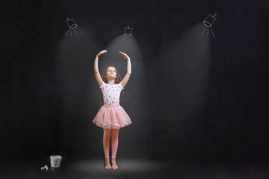 girl dreaming a dansing ballet on the stage.