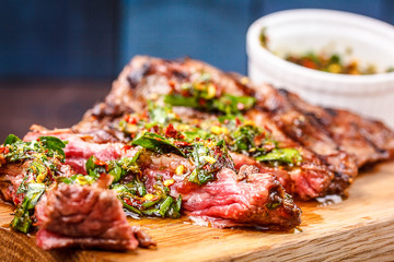 Beef steak rare sauced with herbs, pepper and pine nuts.