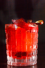 Cocktails or lemonade red (cherry, strawberry, raspberry) on dark table.