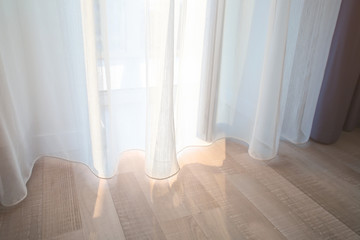 Window and beautiful curtains in flat