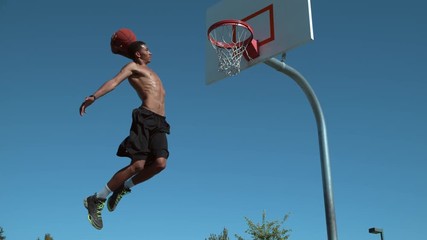 Super slow motion shot of basketball basketball slam dunk, shot on Phantom Flex  - Powered by Adobe
