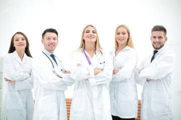 Fototapeta premium Confident doctors posing and smiling at camera
