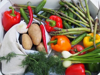 Spring vegetables in wooden white crate