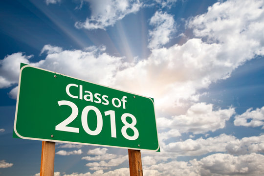 Class of 2018 Green Road Sign with Dramatic Clouds and Sky