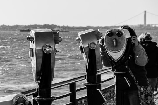 Fototapeta Binocular spyglass field glass on Liberty Island New York black and white