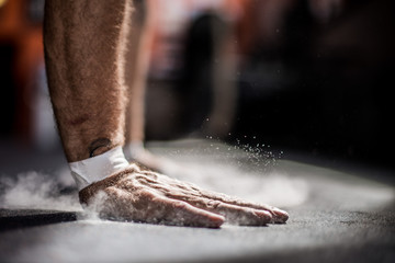 athlete puts hands on the floor
