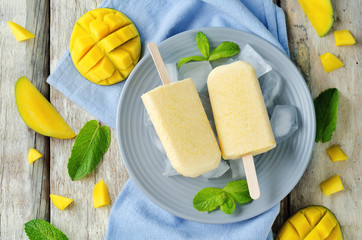 Creamy mango ice cream with fruits and ices
