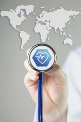 Medical background doctor with stethoscope - medical and health icon with world map 