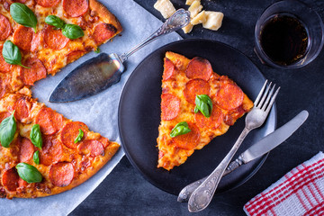 Homemade Pepperoni Pizza served on plate.