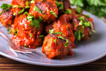 Traditional Italian beef meatballs, tomato sauce and parsley