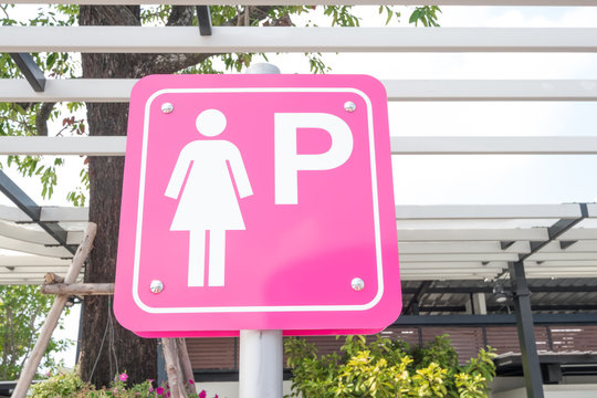Lady parking sign on pink background for women in the public car Park, Thailand. Lady priority concept.