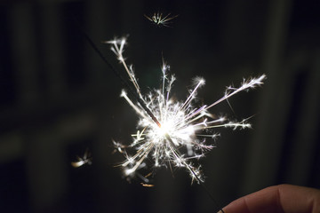 Closeup of bright white festive sparkler burning