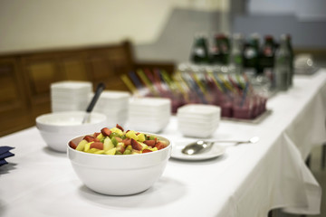 Closeup dessert on buffet table with fresh fruits jelly and cream