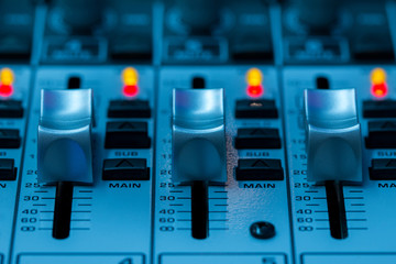 Professional audio mixing console buttons,faders and sliders.