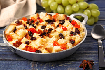 Delicious bread pudding with fruits on table