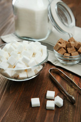 Beautiful composition with sugar on wooden background