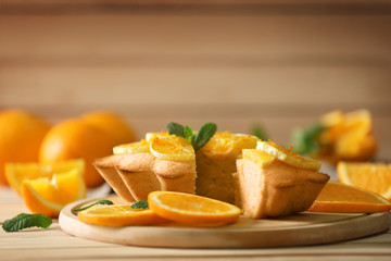 Delicious citrus cake on cutting board