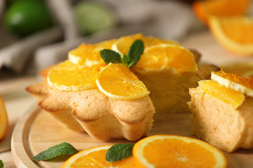 Delicious citrus cake on cutting board