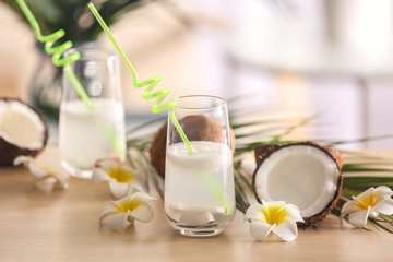 Beautiful composition with coconut water on table