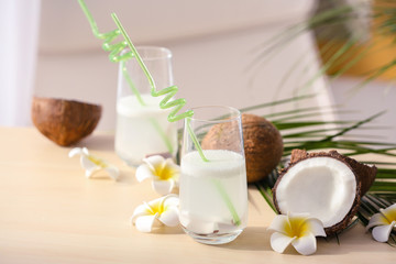 Beautiful composition with coconut water on table
