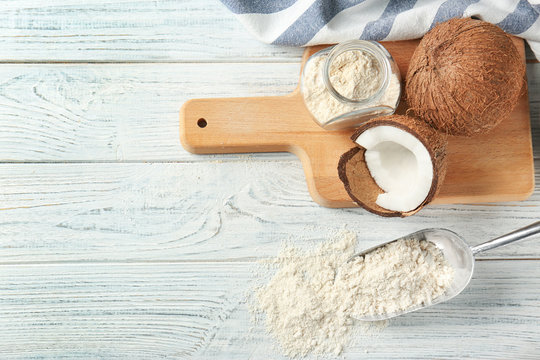 Composition with coconut flour on wooden background