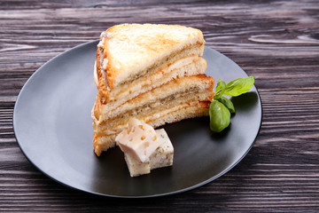 Tasty sandwich with cheese on plate