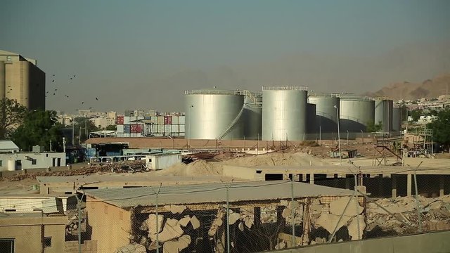 Large capacity tanks in industrial area near port terminal in Aqaba, Hashemite Kingdom of Jordan