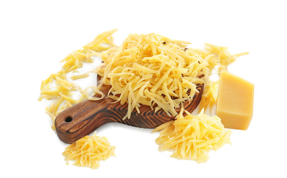 Wooden board with grated cheese on white background