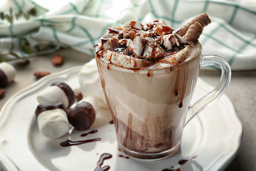 Composition with tasty cocoa drink on table