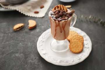 Composition with tasty cocoa drink on grey table