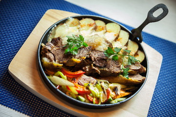 Meat, Potatoes and Salad in Frying Pan