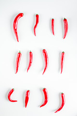 spicy food cooking with red chili white table background top view pattern