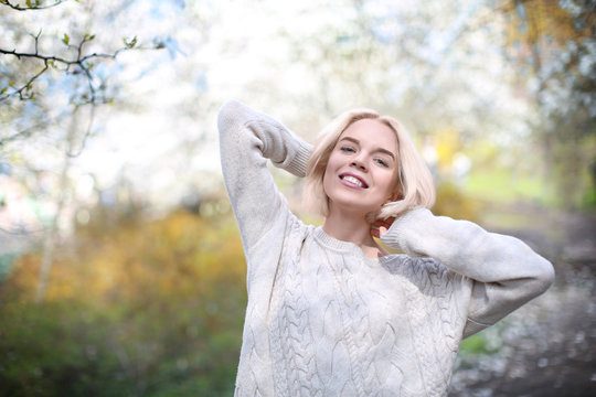 Young blonde girl on blurred background