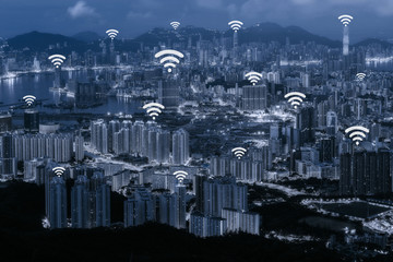 Wifi network connection concept on blue tone Hong Kong cityscape background and network connection concept - Network business conection system