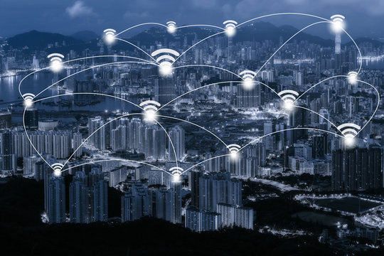 Wifi network connection concept on blue tone Hong Kong cityscape background and network connection concept - Network business conection system