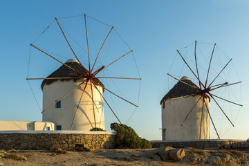Amazing Sunset and White windmills on the island of Mykonos, Cyclades, Greece