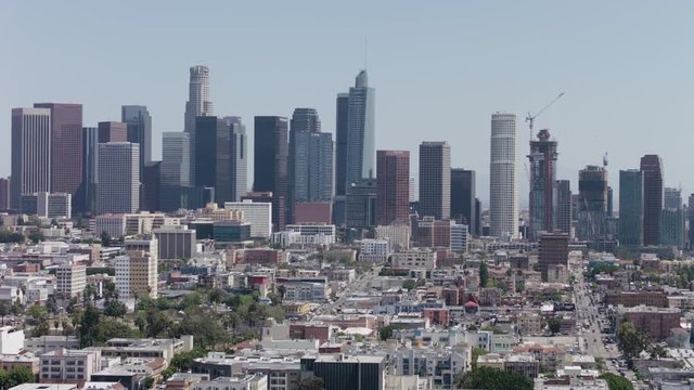 Los Angeles Aerial Skyline Cityscape Sightseeing View. Office Towers Crowded Downtown LA Aerials Panoramic View. Pan and Tilt. 4K 
