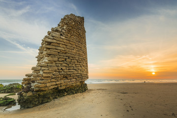 Torre del Loro Roman tower ruins on beach in Mazagon,Spain