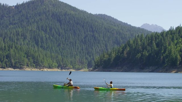 Couple kayaking in lake