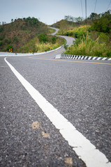 Curve of asphalt road  in mountains. At Nan province, northern of Thailand.  