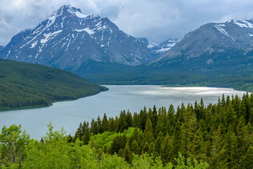 Fototapeta na wymiar Storm at Lower Two Medicine Lake - A stormy spring evening view of Lower Two Medicine Lake and Rising Wolf Mountain at Two Medicine Valley region of Glacier National Park, Montana, USA.