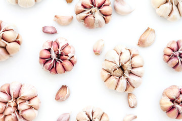Top view of garlic bulb as pattern background on white