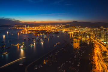 Fototapeta na wymiar Skyline of harbour in Hong Kong at sunset