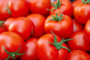 A pile of red tomatoes. .(selective focus)
